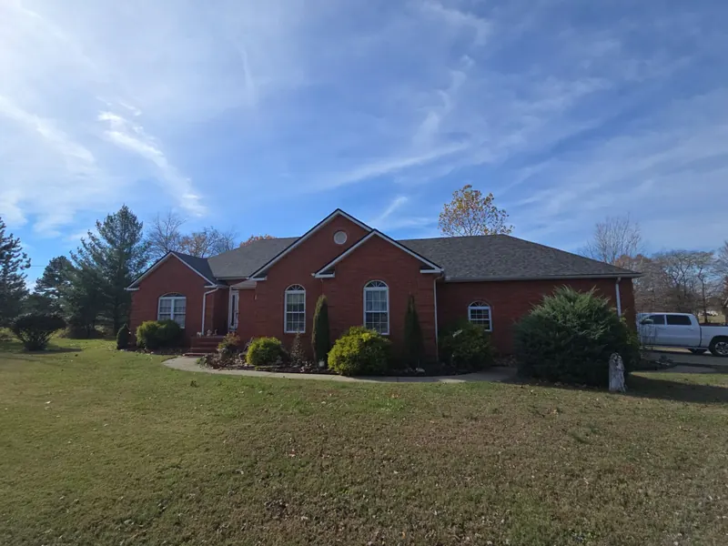 Brick ranch home in Murray, KY with a finished dark architectural shingle roof
