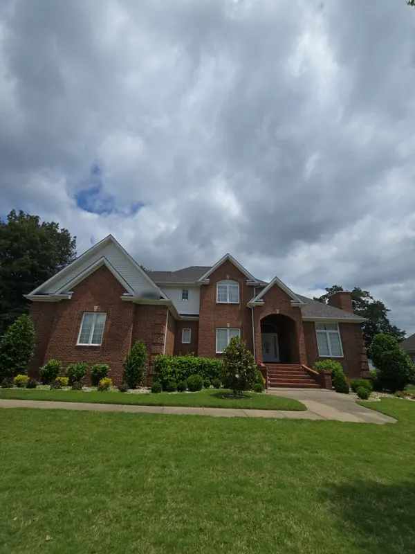 Two-story brick home in Lone Oak, KY with a gray architectural shingle roof